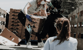 Donation boxes being unloaded from a vehicle